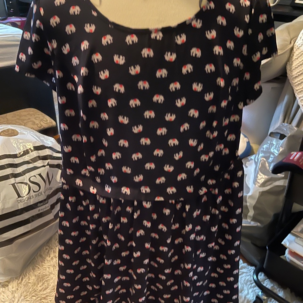 A navy blue elephant zip up dress.